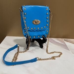 Mellow World Blue vegan leather crossbody handbag with gold chain and rivet trim